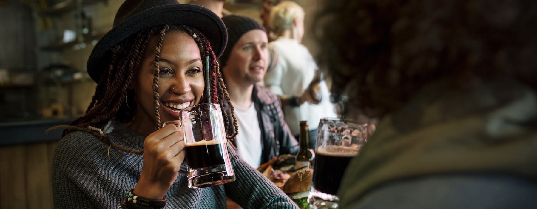 a woman drinking at a bar
