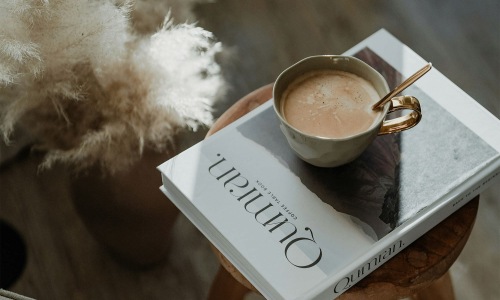 a cup of coffee on a book